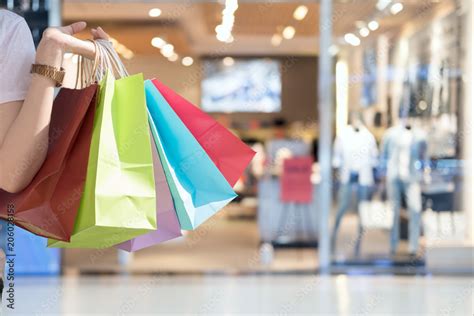 Closeup of woman holding shopping colorful of shopping bags at shopping mall with copy space ...