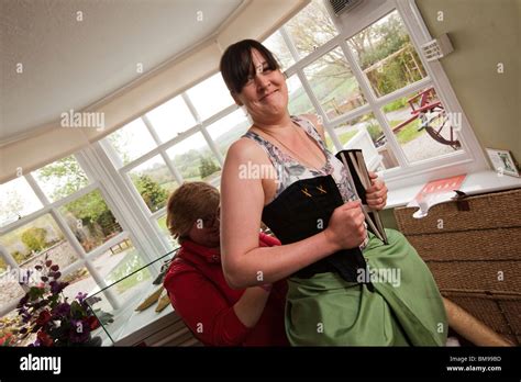 UK, Cornwall, Launceston, Lawrence House Museum, local women dressing up in period costume Stock ...