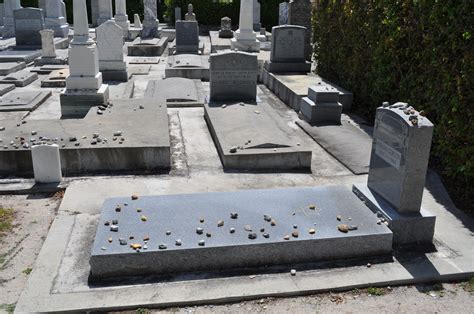 an old cemetery with many headstones and graves