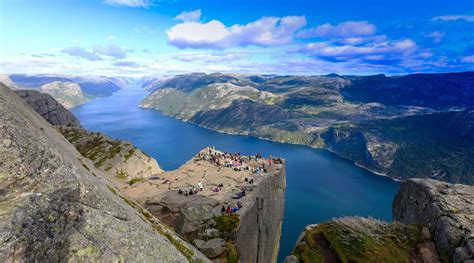 Conquer the three legendary hiking highlights of the Norwegian Fjords, sightseeing in beautiful ...