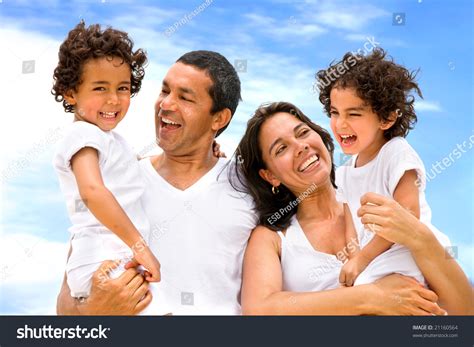 Happy Family Smiling Outdoors While On Vacation Stock Photo 21160564 : Shutterstock