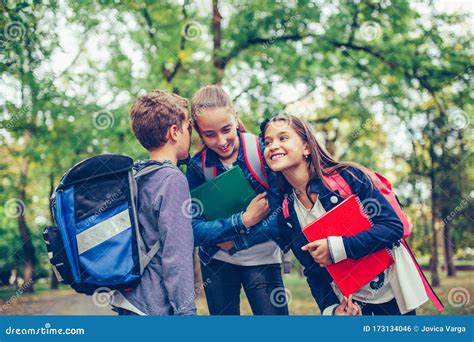 Happy Kids Whispering a Secret Each Other in the Ears Stock Photo - Image of gesture, friend ...