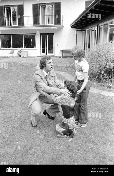 Home story with the Beckenbauer family. Pictured: Franz Beckenbauer (left) in the garden with a ...