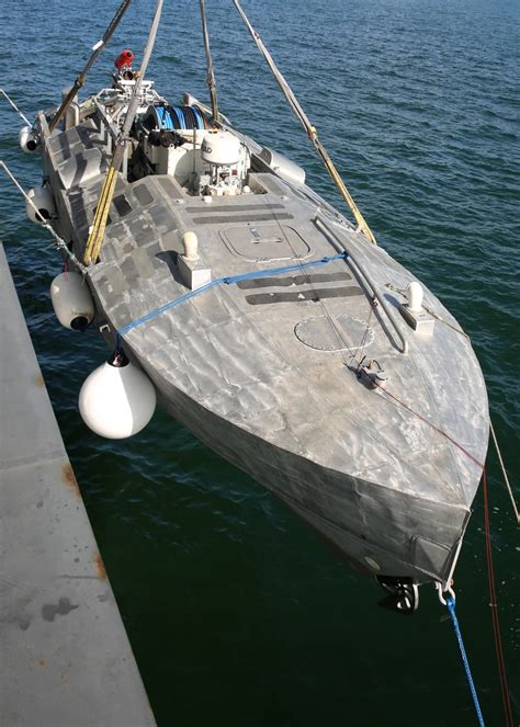 A view of an unmanned surface vehicle (USV) being brought aboard Military Sealift Command's ...