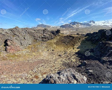 Barren, Desert-like Landscape Surrounded by Majestic Mountains with ...