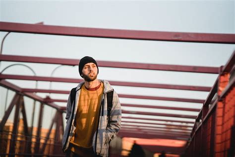 Calm man walking on bridge · Free Stock Photo