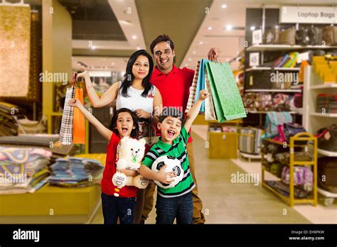 4 indian kids and Parents mall Shopping shouting Stock Photo - Alamy