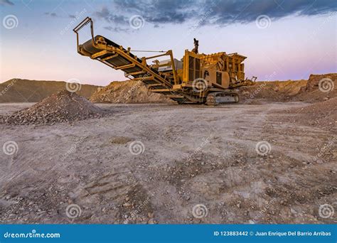 Stone Crusher Machine in a Quarry or Open-pit Mine, To Transform into Gravel Stock Photo - Image ...