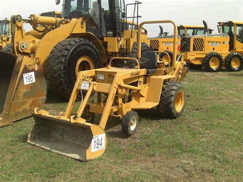 TERRAMITE T5C LOADER BACKHOE - J.M. Wood Auction Company, Inc.