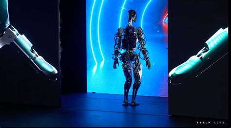 Tesla robotic slowly walks on stage at AI Day