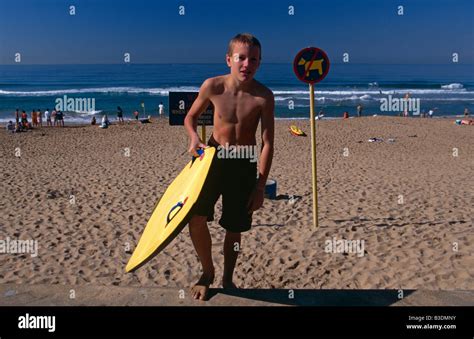 Surfer at a beach in Durban, South Africa Stock Photo - Alamy