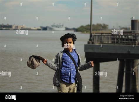 Portrait Of Boy Standing At Beach Stock Photo - Alamy