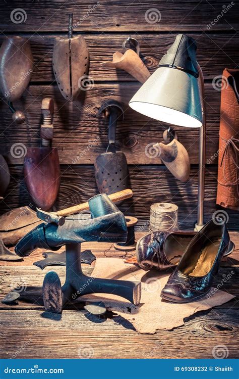 Vintage Shoemaker Workshop With Tools, Leather And Shoes Stock Photo - Image: 69308232