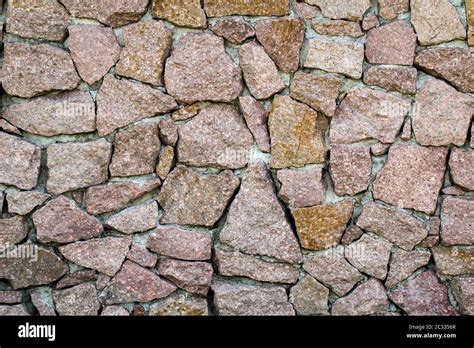 a stone wall of granite stones, stone wall texture Stock Photo - Alamy