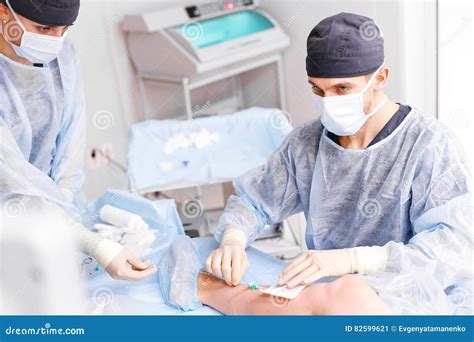 Doctor and an Assistant in Operating Room for Surgical Clinic Stock Image - Image of mask ...