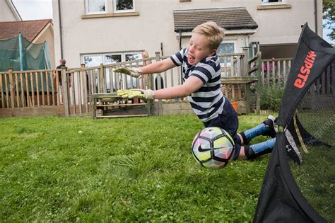 Boy with cerebral palsy - Stock Image - C038/2360 - Science Photo Library