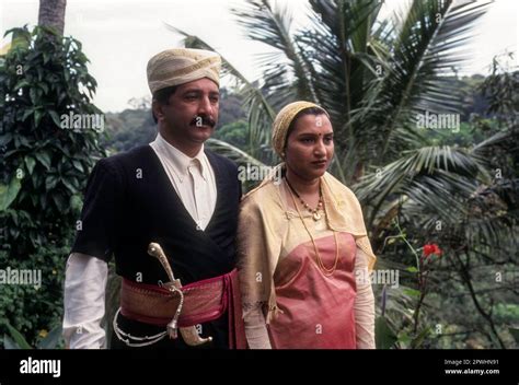 Kodava couple in their traditional dress at Madikeri, Mercara in Kodagu Coorg, Karnataka, India ...