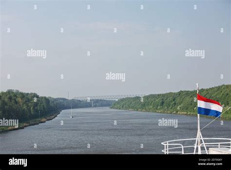 Cruise ship sailing through Kiel canal in Germany. The Kiel Canal goes ...