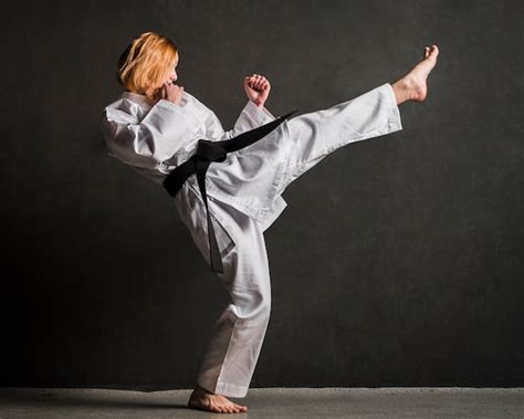 Free Photo | Karate woman kicking full shot