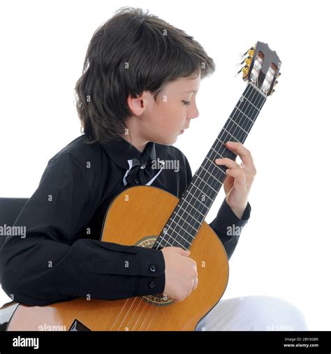 Little boy musician playing guitar Stock Photo - Alamy