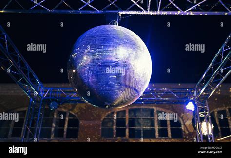 Blue lit disco ball party concept Stock Photo - Alamy