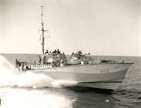 an old photo of a boat in the water with people on it's side