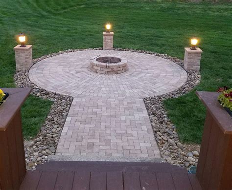 Finally finished the firepit. 14ft diameter. Post lights from Lowe's. Brick from Home Depot. # ...