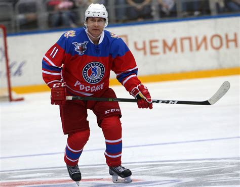 Russian President Vladimir Putin attends an ice hockey match of the ...