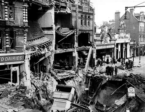 WWII. A bus lies in a bomb crater after a German night air raid during the Blitz in Balham ...