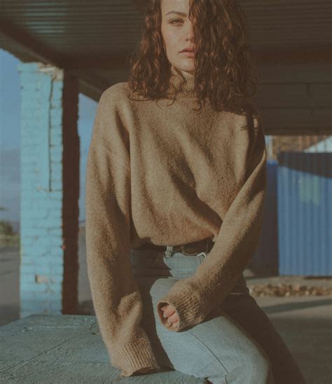 Woman Sitting on Ledge · Free Stock Photo