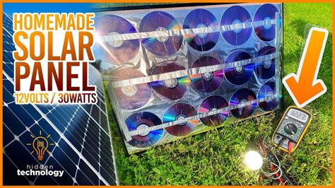 a solar panel with cd's in it on the grass