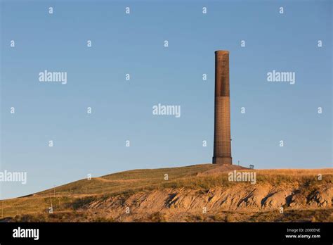 The sun sets at the Anaconda Smelter Stack in Anaconda Montana. Built in 1918 as part of the ...