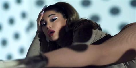 Ariana Grande drops into a split and twerks in her new music video, and fans are joking the sexy ...