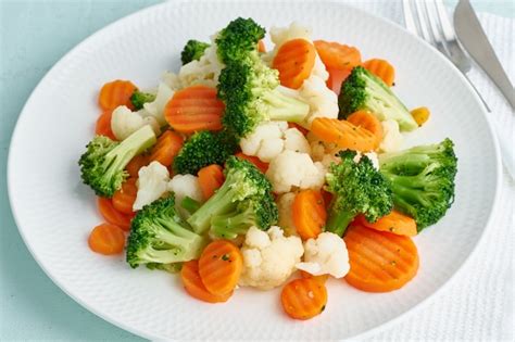 Premium Photo | Mix of boiled vegetables. broccoli, carrots, cauliflower. steamed vegetables for ...