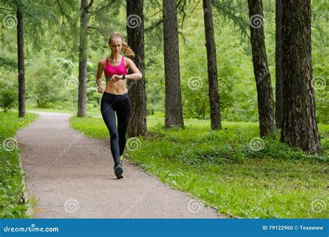 Young Woman Jogging in the Park Stock Photo - Image of rate, healthy ...