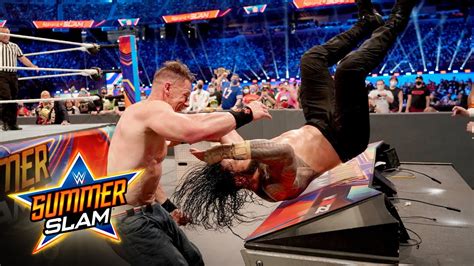 John Cena gives Roman Reigns a crushing Attitude Adjustment: SummerSlam ...