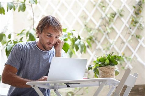 Premium Photo | Businessman working on laptop outdoors