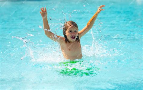 Premium Photo | Child splashing in summer water pool kid splash in pool ...