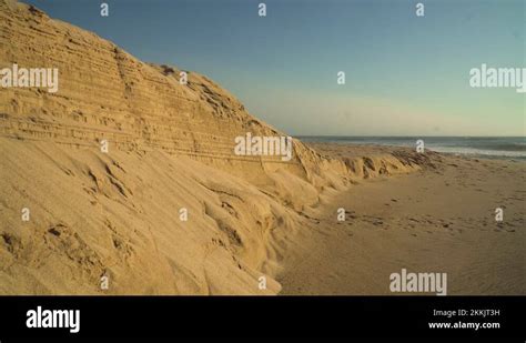 4K coastal sand erosion on beach. Sand dunes loss, climate and landscape Stock Video Footage - Alamy