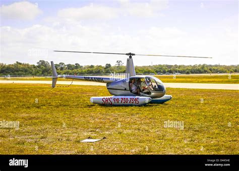 A Robinson R44 Helicopter with floats at venice Airport Florida Stock Photo - Alamy