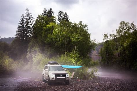 Premium Photo | Car camping at mountain river