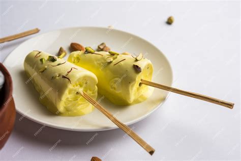 Premium Photo | Rajasthani home made ready to eat matka kulfi - saffron or kesariya flavoured ...