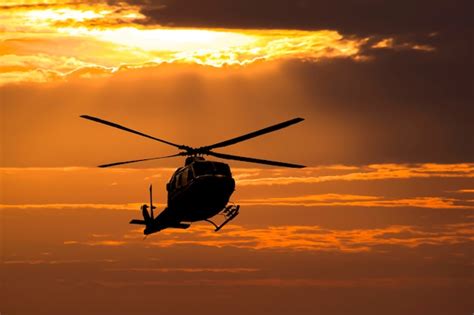 Premium Photo | Helicopter on sunset