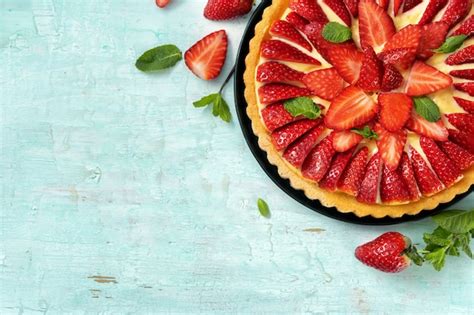 Premium Photo | Flat lay of strawberry flan cake on light mint background