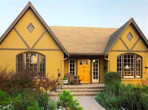 Mustard Yellow Tudor-Style Home Exterior | Exterior paint colors for house, Yellow house ...