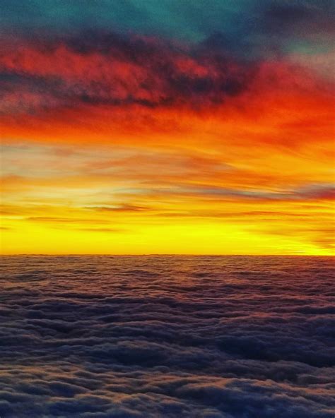 Sunset above the clouds, from a plane that is about to land in Nuremberg/Germany [OC][2888x3610 ...