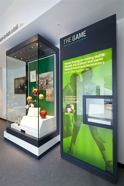 a display case in the middle of a room filled with green and white items,