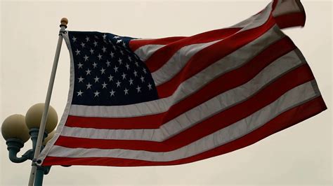 An American Flag Flies In Slow Motion In Stock Footage SBV-324627808 ...