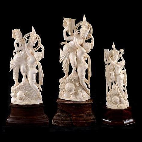 Three graduated Indian ivory carvings of a pair of deities in an ...