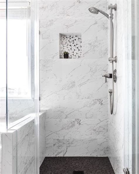 Marble shower with black tile floors - sleek light and bright bathroom design | Shower tile ...